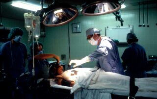Doctors perform surgery on a thyroid cancer patient.