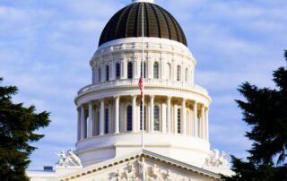Vertically-cropped photo of the California State Capitol Building in Sacramento.